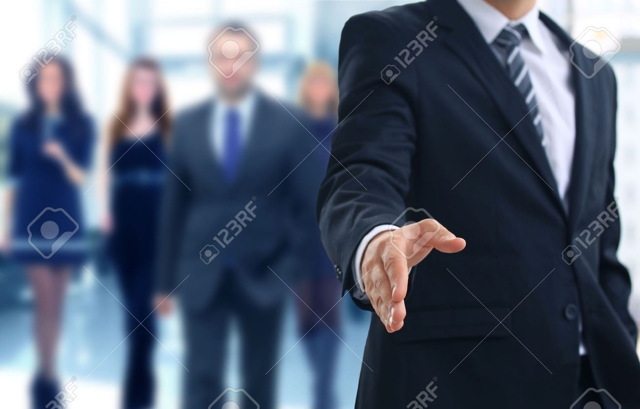 30674354-A-business-man-with-an-open-hand-ready-to-seal-a-deal-Stock-Photo.jpg